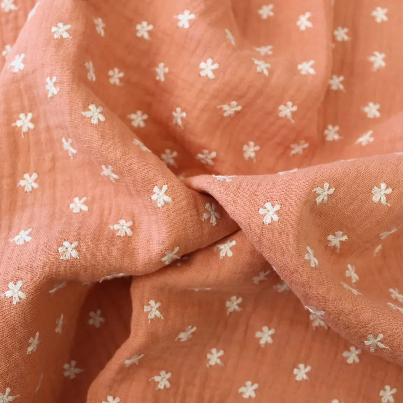 Mussola di cotone con fiori ricamati - Salmone | ILTESSUTAIO