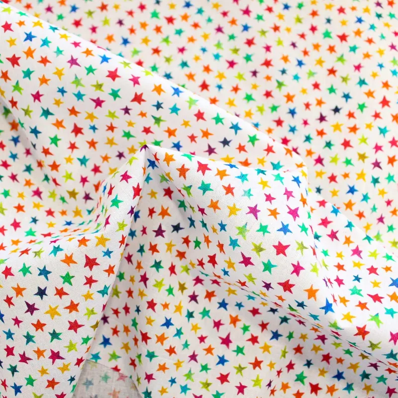 Tessuto di cotone stelline multicolor | TESSUTI PER BAMBINI