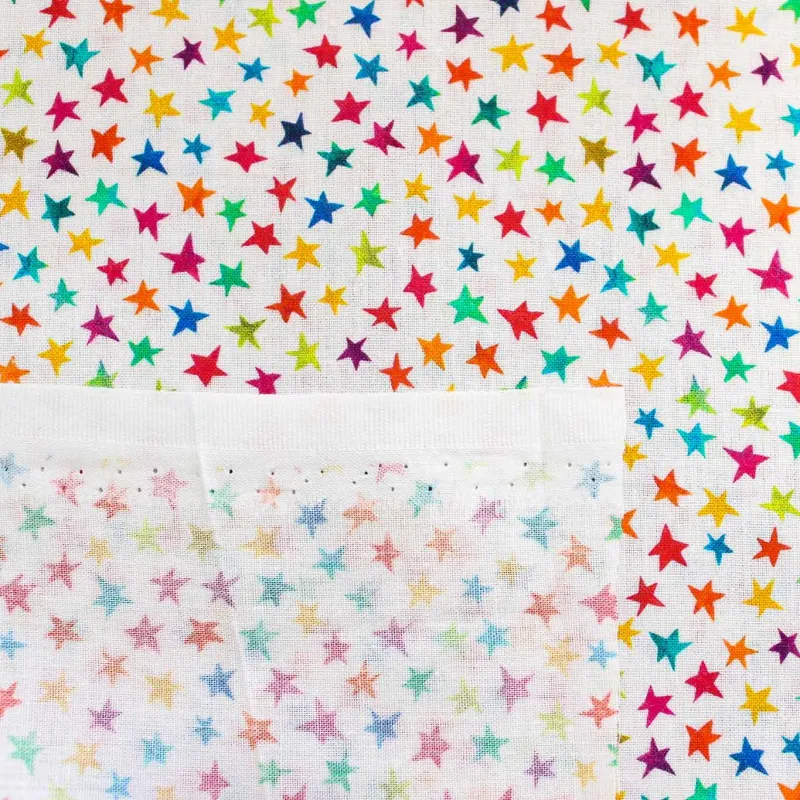 Tessuto di cotone stelline multicolor | TESSUTI PER BAMBINI
