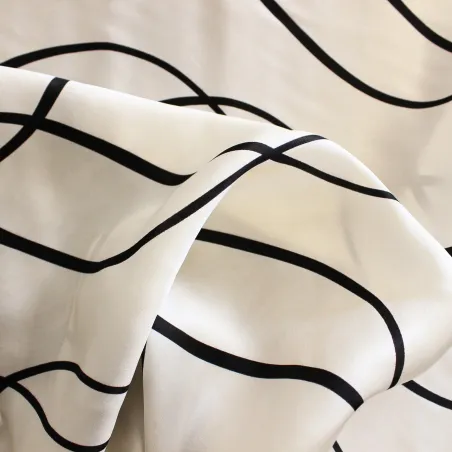 Raso con stampa astratta bianco nero | IL TESSUTAIO