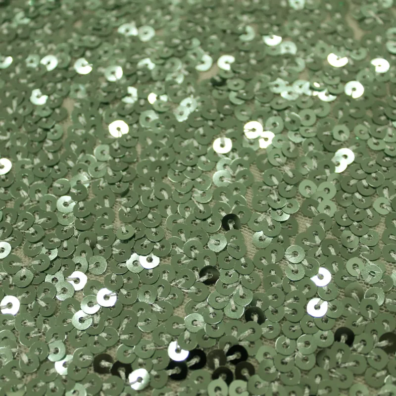Tessuto con Paillettes verde chiaro | IL TESSUTAIO