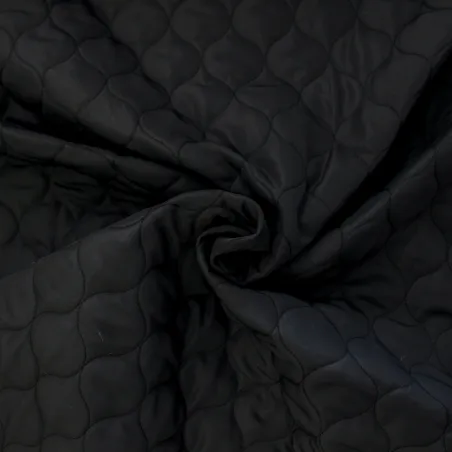 Tessuto trapuntato nero | tessuti per copertine e giubbini