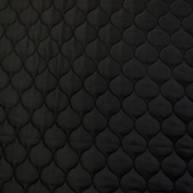 Tessuto trapuntato nero | tessuti per copertine e giubbini