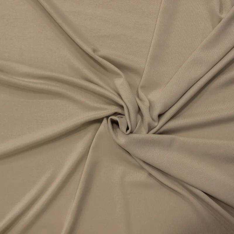 Tessuto in maglina elastica  di colore beige | ILTESSUTAIO
