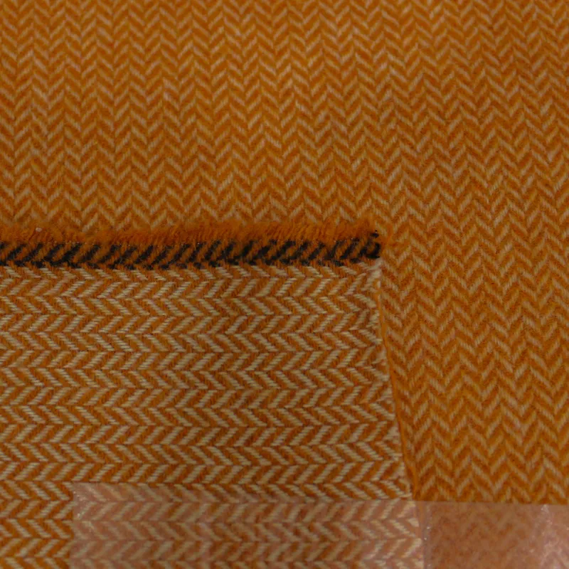 Tessuto per cappotto spigato in misto lana arancio | tessuto deadstock