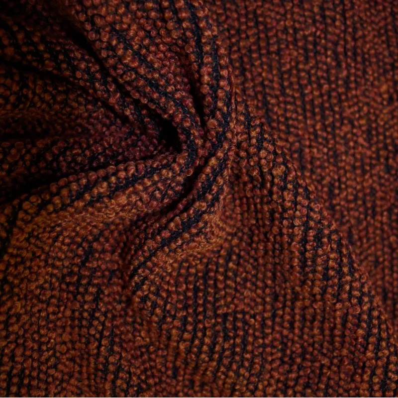 Morbido boucle' arancio scuro e nero | tessuti deadstock