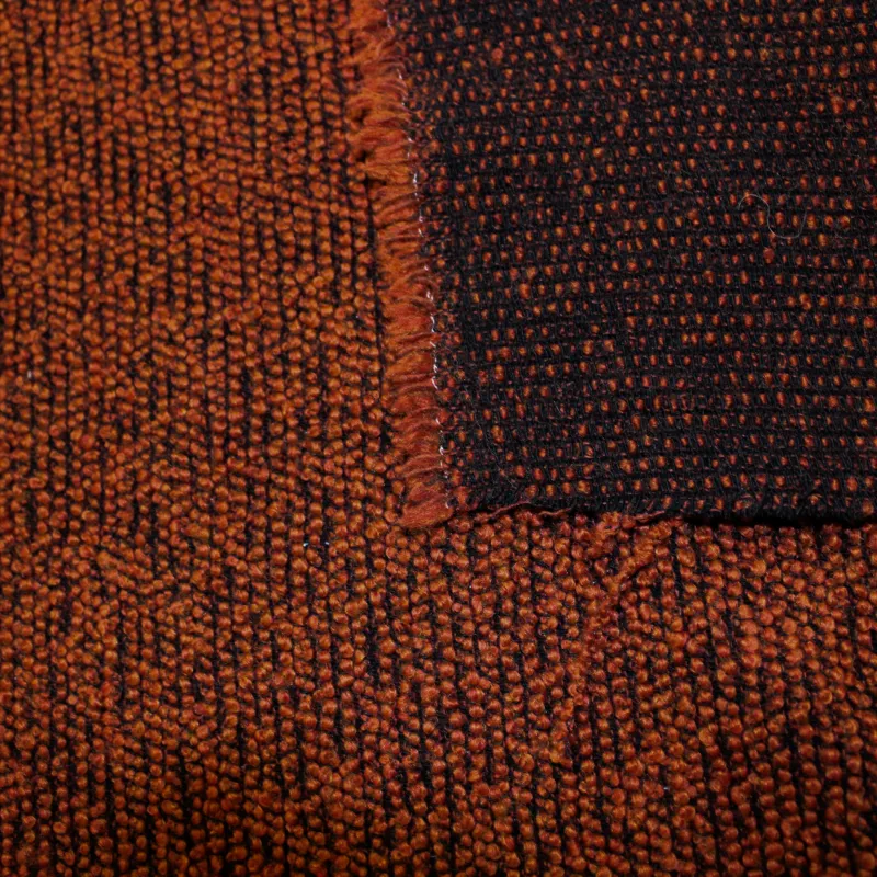 Morbido boucle' arancio scuro e nero | tessuti deadstock
