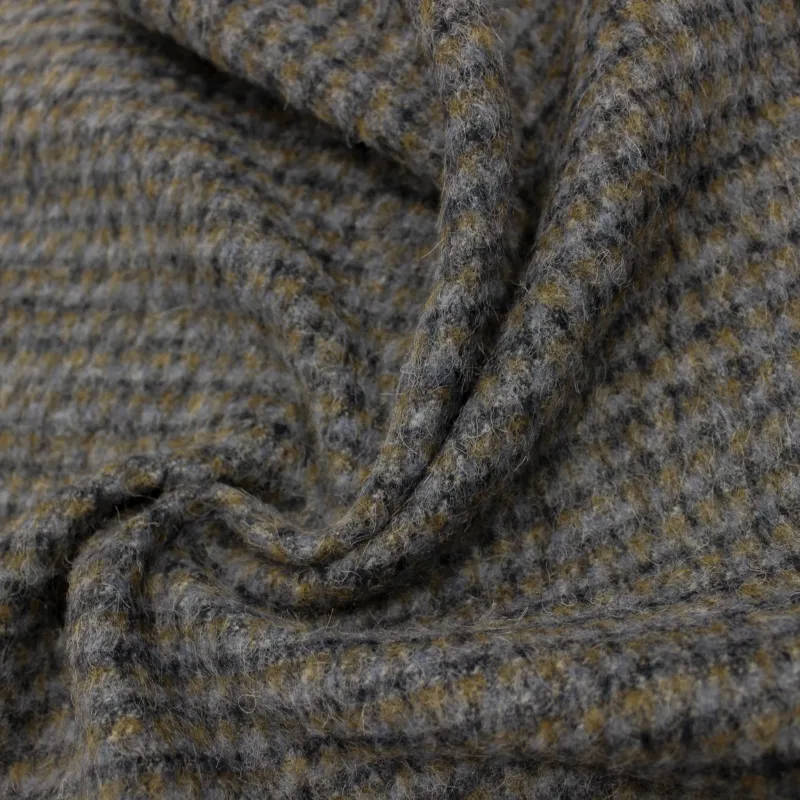 Tessuto per cappotto puntinato grigio in lana