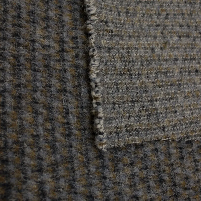 Tessuto per cappotto puntinato grigio in lana