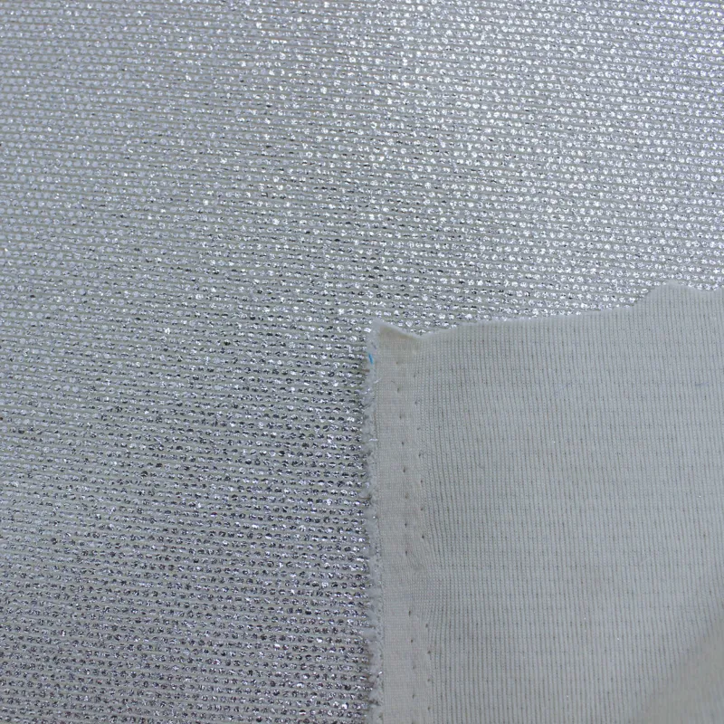 Tessuto in maglia elasticizzata spalmato argento  | tessuti cerimonia