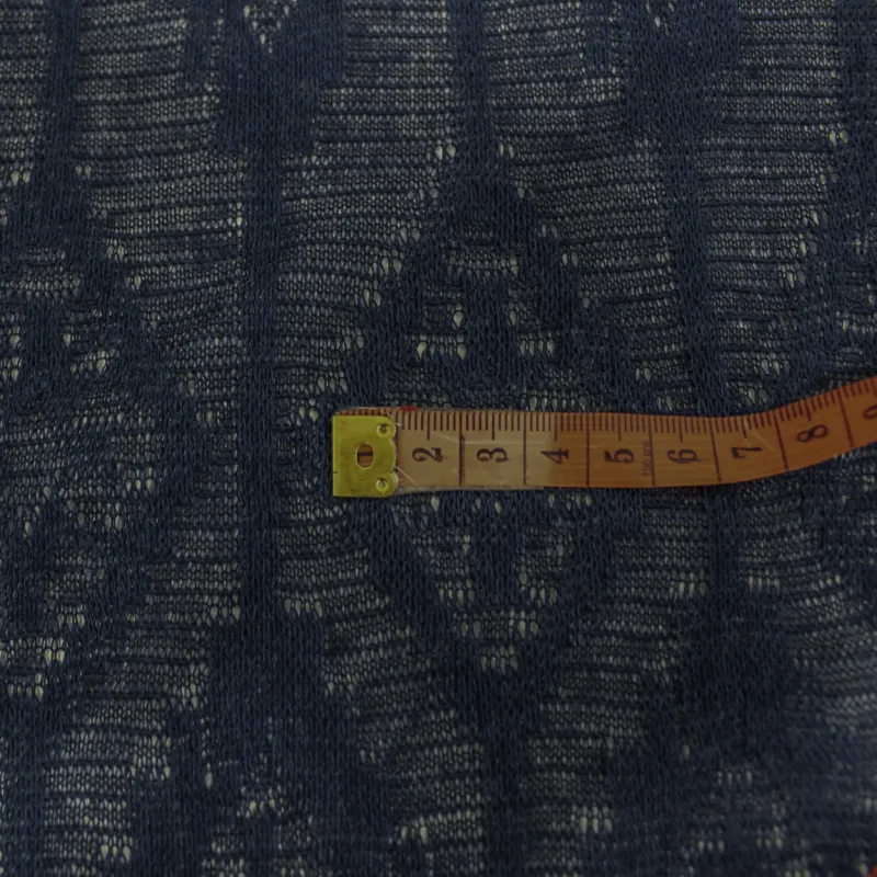 Tessuto a maglia elasticizzata  semi trasparente blu| IL TESSUTAIO