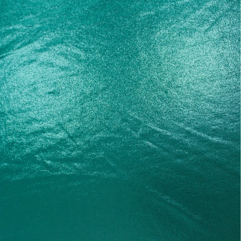 Tessuto Maglina Elasticizzata Verde Acqua Scuro Spalmata | Morbidezza e Luminosità per Abiti Trendy