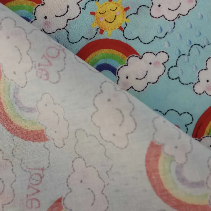 TESSUTO DI COTONE FANTASIA NUVOLE E ARCOBALENI | ILTESSUTAIO.IT