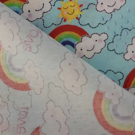 TESSUTO DI COTONE FANTASIA NUVOLE E ARCOBALENI | ILTESSUTAIO.IT