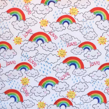 TESSUTO DI COTONE FANTASIA NUVOLE E ARCOBALENI | ILTESSUTAIO.IT