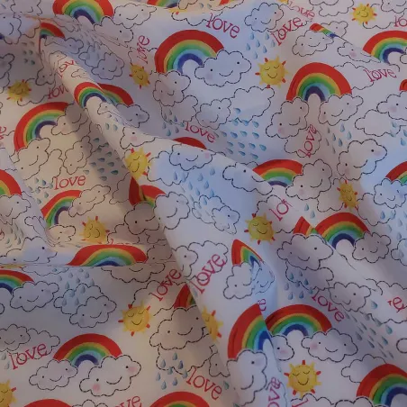 TESSUTO DI COTONE FANTASIA NUVOLE E ARCOBALENI | ILTESSUTAIO.IT