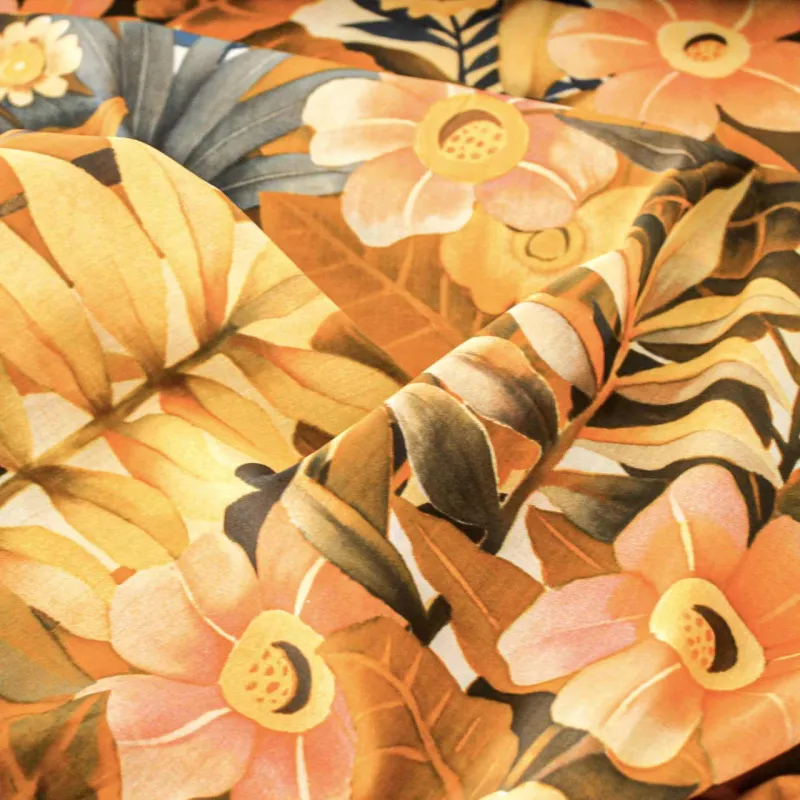 Viscosa tessuto fantasia floreale arancio | tessuti pregiati