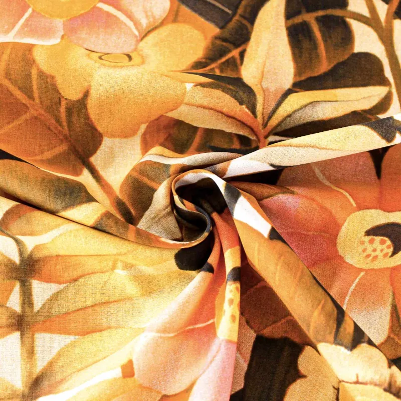 Viscosa tessuto fantasia floreale arancio | tessuti pregiati